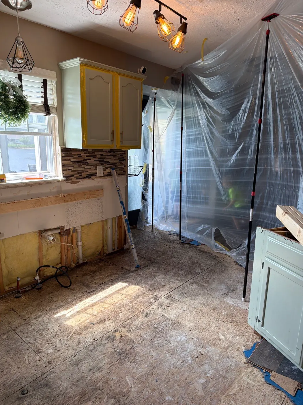Moisture meter reading on drywall during a water loss, Belleville service area
